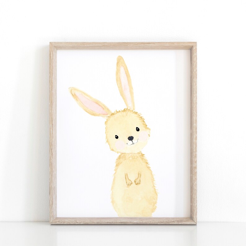 May include: A watercolor painting of a light brown bunny rabbit with pink ears. The bunny is standing on its hind legs with its front paws crossed. The bunny is looking at the viewer with a friendly expression.