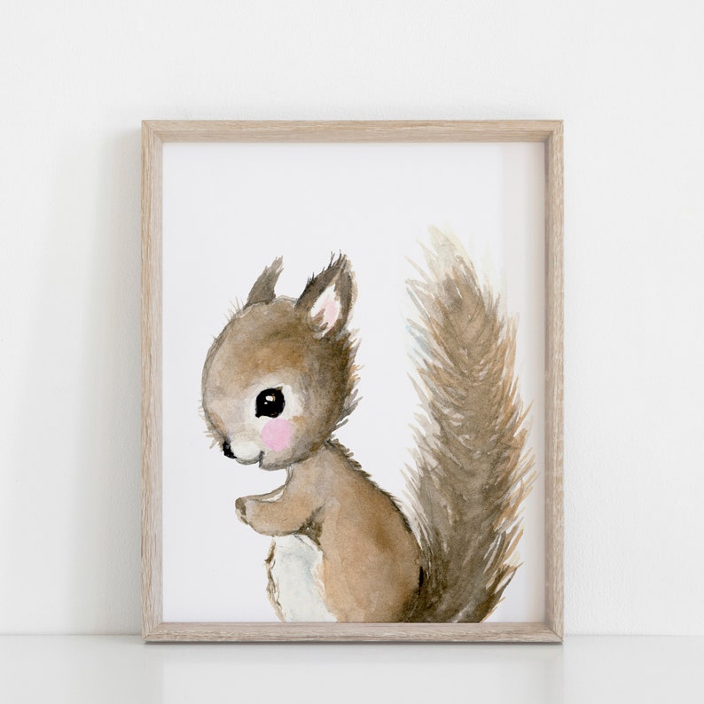May include: A watercolor painting of a brown squirrel with a fluffy tail. The squirrel is standing on its hind legs and has a pink nose and cheeks.