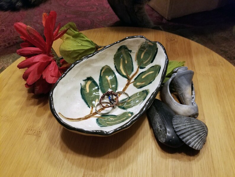 Small artisan made stoneware jewelry dish with hand painted leaf design