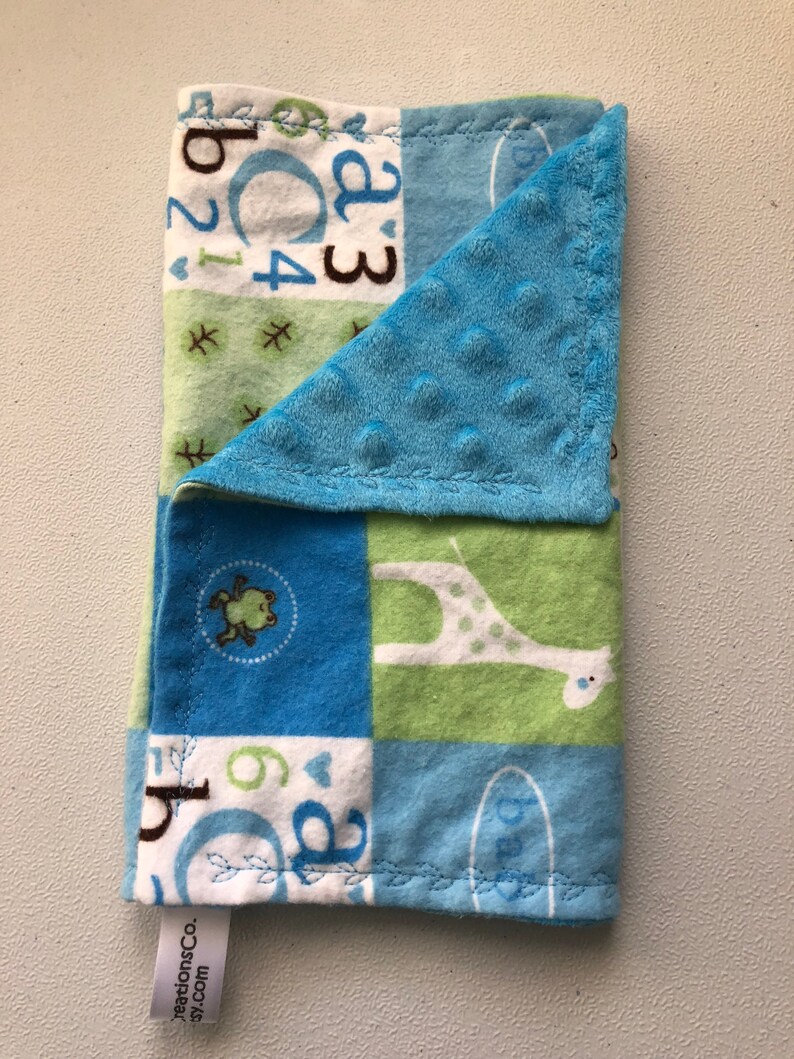 Blue green and white blocks with ABC/'s and giraffes burp clothes and changing pad cover