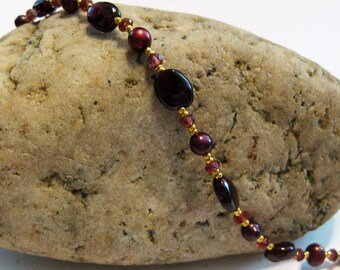 Garnet and red pearl with gold glass bead bracelet