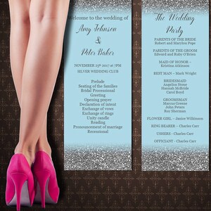 May include: Two light blue wedding ceremony cards with silver glitter borders. The left card lists the wedding ceremony order, including the prelude, seating of the families, bridal processional, greeting, opening prayer, declaration of intent, exchange of vows, exchange of rings, unity candle, reading, pronouncement of marriage, and recessional. The right card lists the wedding party, including the parents of the bride and groom, maid of honor, best man, bridesmaids, groomsmen, flower girl, ring bearer, ushers, and officiant.