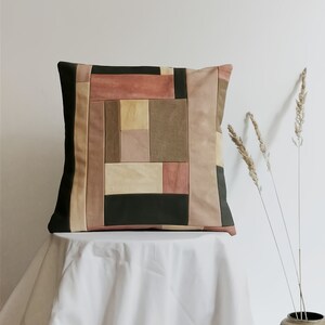 Patched pillowcase made with plant-dyed canvas remnant. Color-blocking in pink and moss green. Patchworked original art for your living room