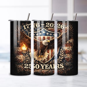 May include: Three black insulated tumblers with silver straws. Each tumbler features a design with an American flag, an eagle, and the text "1776-2026 250 YEARS". The design is in shades of red, white, blue, and brown.