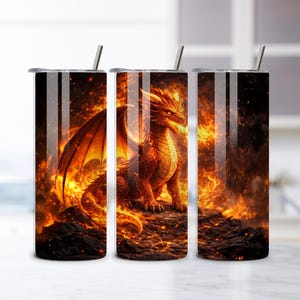 May include: Three stainless steel tumblers with a dragon design. The dragon is orange and red, set against a fiery background. Each tumbler has a silver straw and a black lid. The design wraps around the entire tumbler.