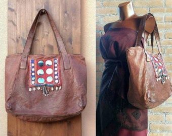 Large tote bag made of an Italian distressed leather, very soft. Embellished with an antique Banjara cloth