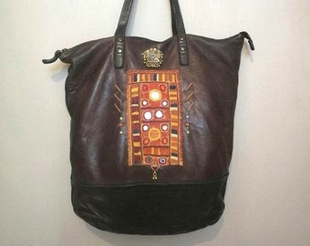 Ethnic brown leather tote bag, decorated with orange Banjara Indian gala and Afghan kuchi pendant