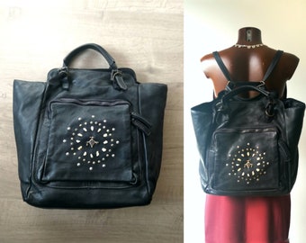 Bag backpack in black vegetable-washed Italian leather, front pocket decorated with an Afghan kuchi pendant