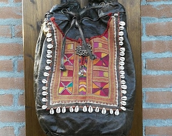 Large backpack for women handmade of aged italian leather, with Banjara decoration and cowrie shells