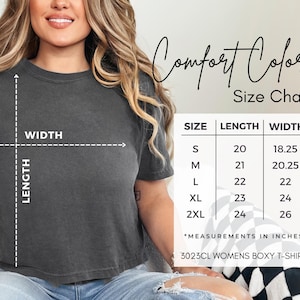 May include: A dark gray boxy t-shirt with a size chart. The chart shows measurements in inches for sizes S to 2XL. The text "Comfort Colors" and "3023CL WOMENS BOXY T-SHIRT" are also visible.