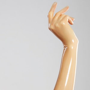 Long gloves made of molded latex in natural translucent color