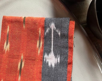 Gray and orange ikat weave dinner napkins set of 2 - reusable cloth napkins with reverse trim - handmade unique design table setting.