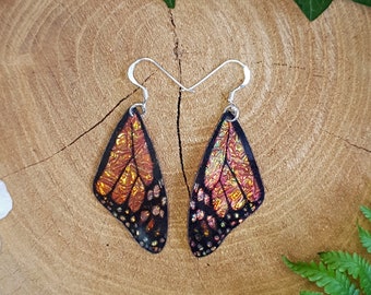 Monarch butterfly wing earrings. Handmade cruelty free orange iridescent butterfly wings on sterling silver ear wires.