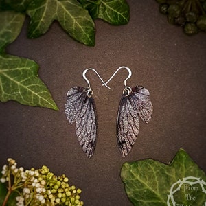 Small silver and black training wings. Handmade sparkle fairy wing earrings. Magical fantasy faerie jewellery gift for an enchanted friend