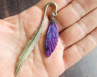 Small fairy wing bookmark. Silver metal bookmark with a sparkly purple faerie wing charm. Handmade fantasy page marker gift for book lover.