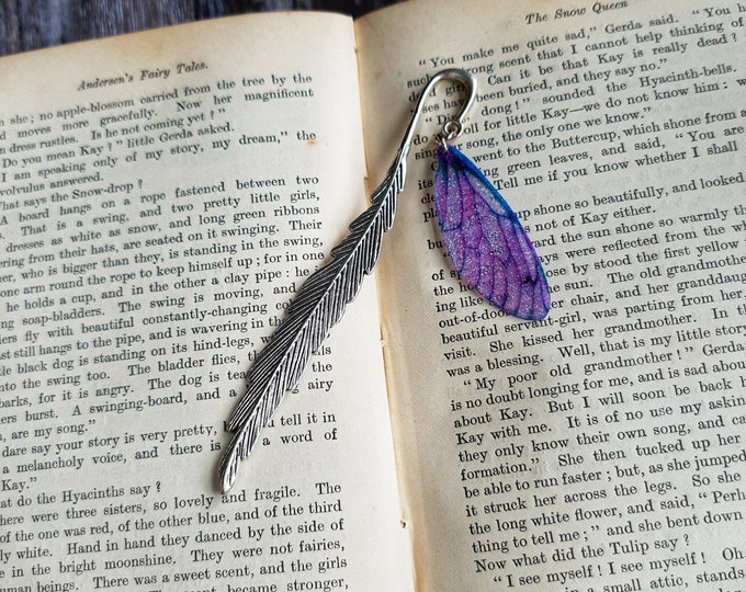Featured listing image: Fairy wing bookmark. Metal silver bookmark with a sparkly pink fairy wing charm.