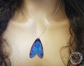 Midnight blue fairy wing necklace on a 925 sterling silver 18 inch chain.