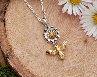 Gold bee and flower necklace. 18k gold on a solid sterling silver pendant.