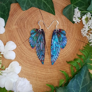 Opal iridescent fairy wing earrings. Handmade fantasy fairy wings on a choice of ear wires.