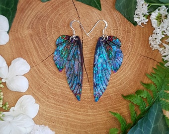 Opal iridescent fairy wing earrings. Handmade fantasy fairy wings on a choice of ear wires.