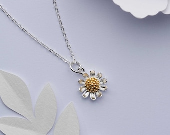Sterling silver daisy flower necklace. Solid sterling silver with 18k gold centre daisy pendant. April birth flower.