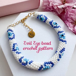 May include: White and blue crochet bracelet with a gold clasp and a small gold tag that says "UNIQ". The bracelet is made with evil eye beads and has a white background with blue and turquoise evil eye beads. The text "Evil Eye bead crochet pattern" is written below the bracelet.
