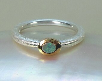 Ring with multicolored iridescent opal, delicate