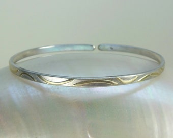minimalist bangle made of silver and gold