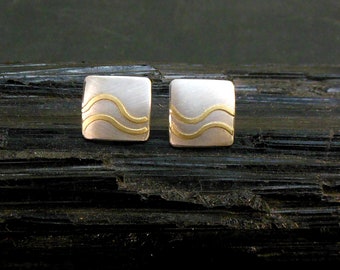 Silver stud earrings with gold waves