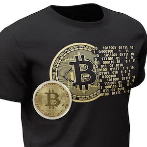 May include: A black t-shirt featuring a gold Bitcoin logo and binary code printed on the front. The logo depicts a stylised "B" with circuit board-like details. The binary code is arranged in a circular pattern around the logo.