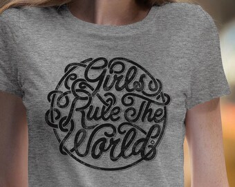 May include: A gray t-shirt with a black graphic that says "Girls Rule The World" in a stylized font.