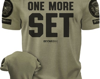 May include: A green t-shirt with the text "ONE MORE SET" in black. The shirt has a logo on the front that says "GYMISH LIFESTYLE" and a weight plate design on each sleeve.