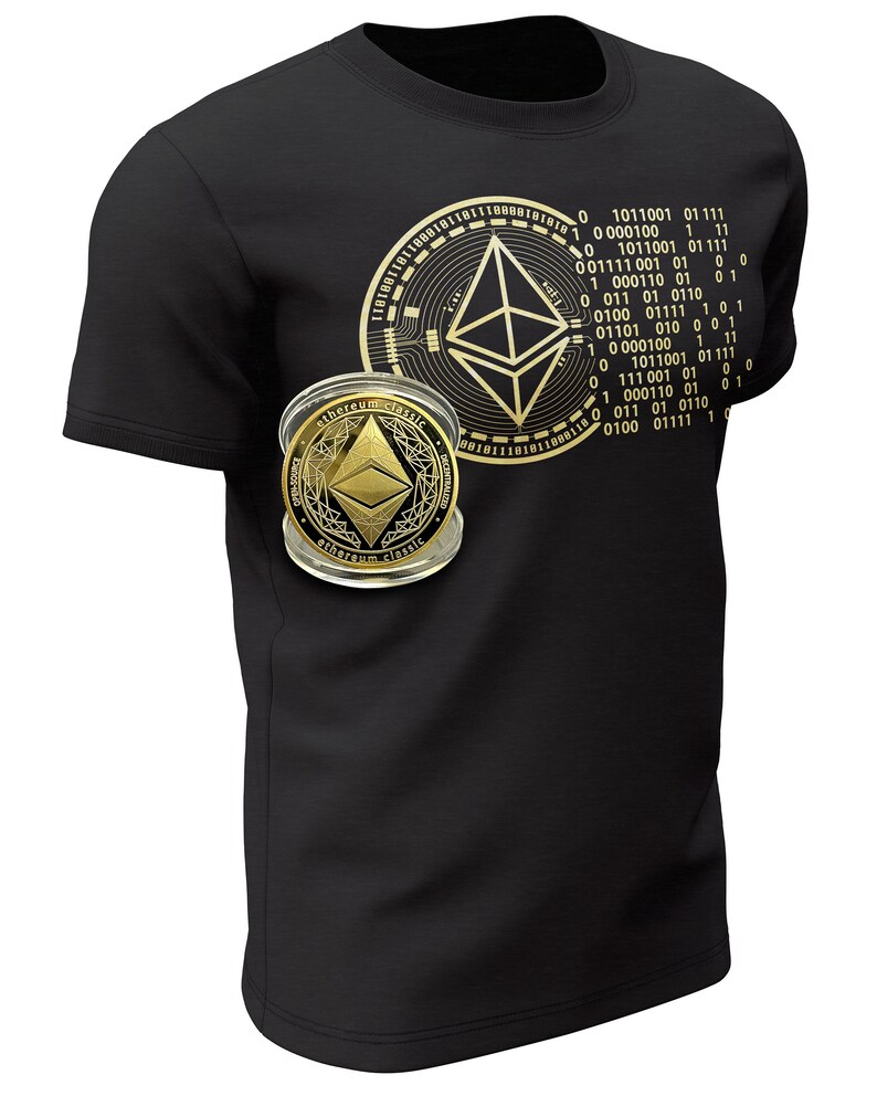 May include: A black t-shirt with a gold Ethereum logo and binary code printed on the front. The logo is surrounded by a circle of circuit board designs. A gold Ethereum coin is visible in the lower left corner of the shirt.