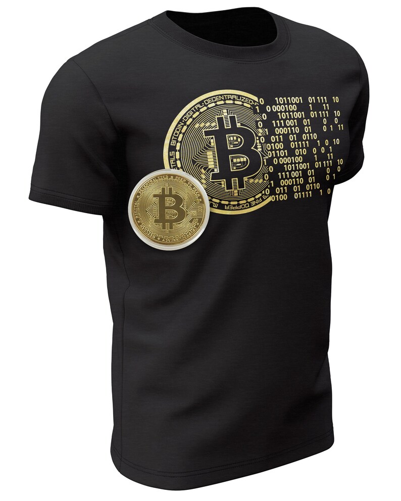 May include: A black t-shirt with a gold Bitcoin logo and binary code printed on the front. The logo features a stylized 'B' with circuit board-like details. The binary code is arranged in a circular pattern around the logo.