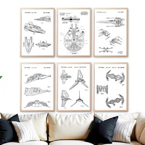 May include: Six framed black and white Star Wars patent prints. The prints feature detailed technical drawings of various spacecraft, including the Millennium Falcon and X-wing fighters. The prints are displayed above a white sofa with black and white cushions.