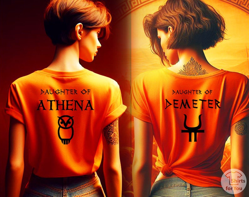 May include: Two women wearing orange t-shirts with Greek mythology designs. The first shirt says "Daughter of Athena" with an owl graphic. The second shirt says "Daughter of Demeter" with a trident graphic.