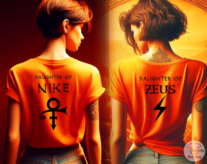 May include: Two women wearing orange t-shirts with different Greek god designs. The woman on the left has a Nike symbol and the text "Daughter of Nike". The woman on the right has a lightning bolt symbol and the text "Daughter of Zeus".