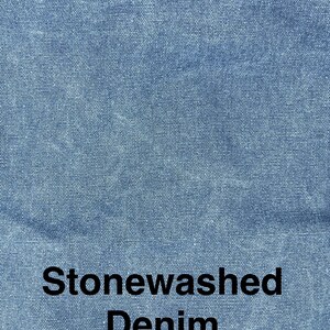 May include: Close-up of stonewashed denim fabric in a light blue color. The fabric has a textured appearance with a subtle, faded effect. The words "Stonewashed Denim" are printed in black, centered at the bottom of the image.