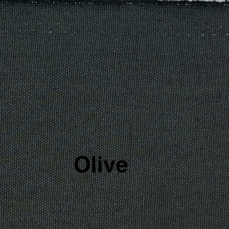 May include: Close-up of a textured fabric in a dark olive green color. The word "Olive" is printed in black, centered on the fabric. The fabric appears to be a tightly woven material.