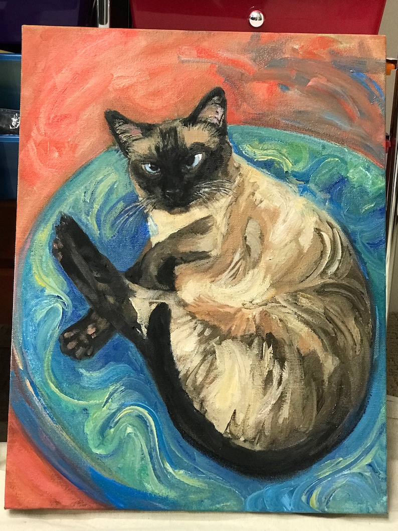 May include: A painting of a Siamese cat curled up in a blue and green swirl. The cat has blue eyes and a light brown and white coat.