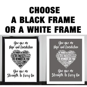 May include: Two framed prints of a heart-shaped word cloud with the text "You give me Hope and Consolation" and "You give me Strength to Carry On". The print on the left has a black frame and the print on the right has a white frame.