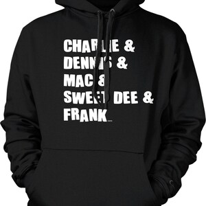 May include: Black hooded sweatshirt with white text listing the names "Charlie & Dennis & Mac & Sweet Dee & Frank". The sweatshirt has a drawstring hood and a front pocket.