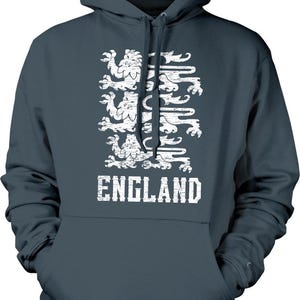 A dark grey hoodie with a white graphic design depicting a group of lions, representing the United Kingdom.