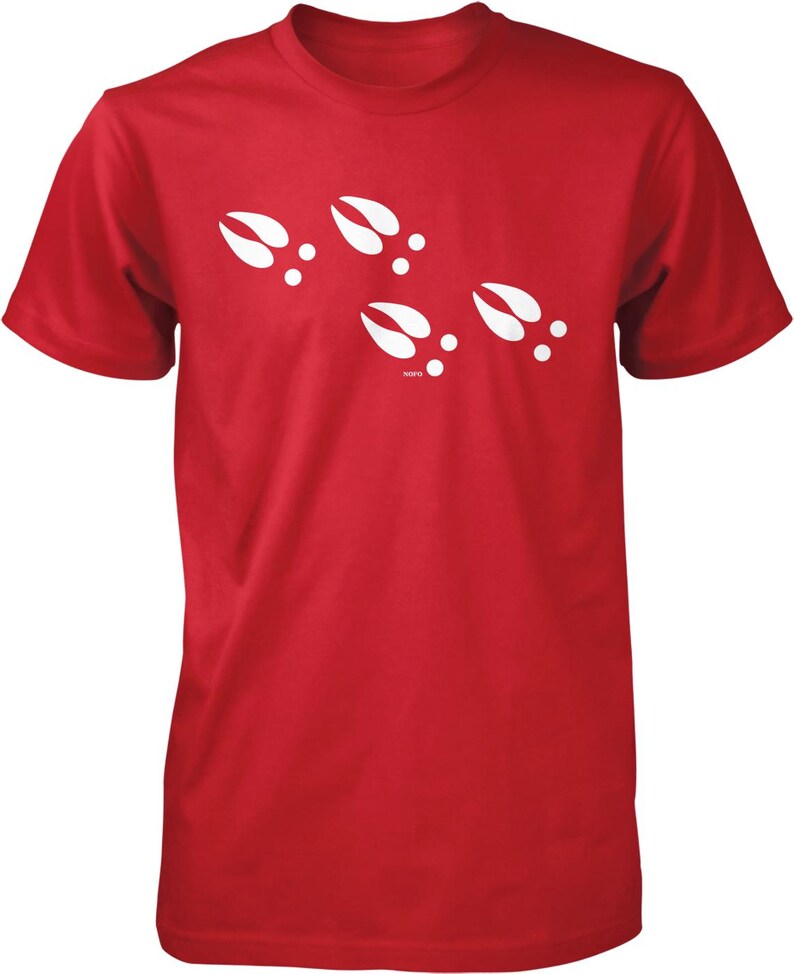 A red t-shirt with white paw prints printed on it.