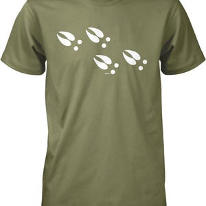 A green t-shirt with white paw prints printed on it.