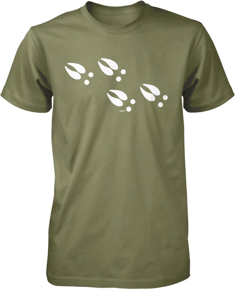 A green t-shirt with white paw prints printed on it.