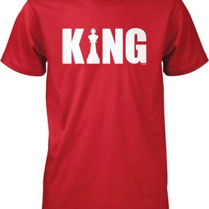 A red t-shirt with the word "KING" printed in white letters.