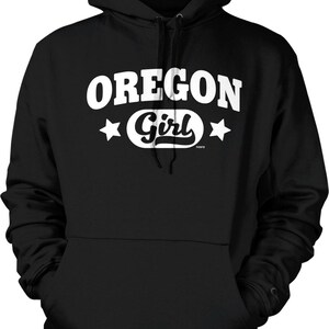 A black hoodie with the text "OREGON GIRL" printed on it in white.
