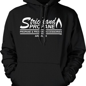 May include: Black hooded sweatshirt with a front pocket and drawstring. The white text on the front reads "Strickland Propane" with a flame graphic. Below the main text are the words "Propane & Propane Accessories".