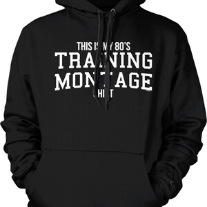 May include: Black hooded sweatshirt with white text that reads "This is my 80's Training Montage"